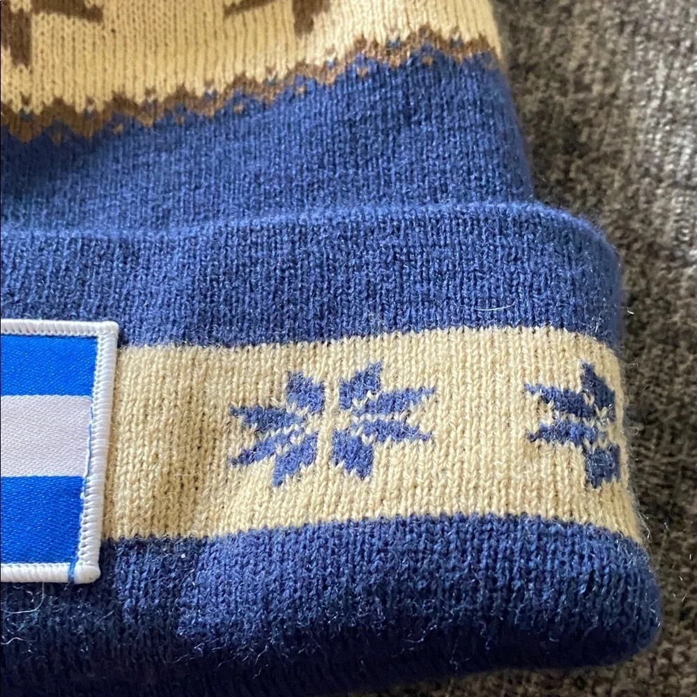 Cirque Blue and Tan Beanie with Colorado Patch. Designed in Vail, CO.